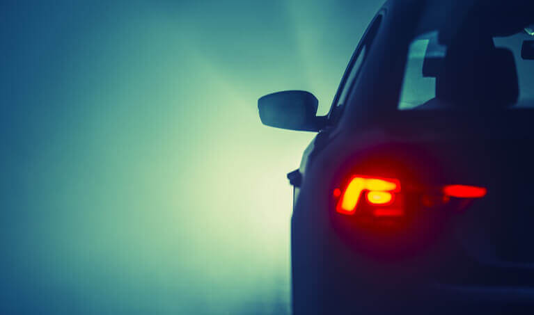 Car driving in the fog