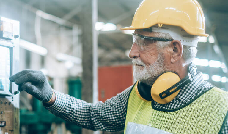 Worker wearing protective safety equipment