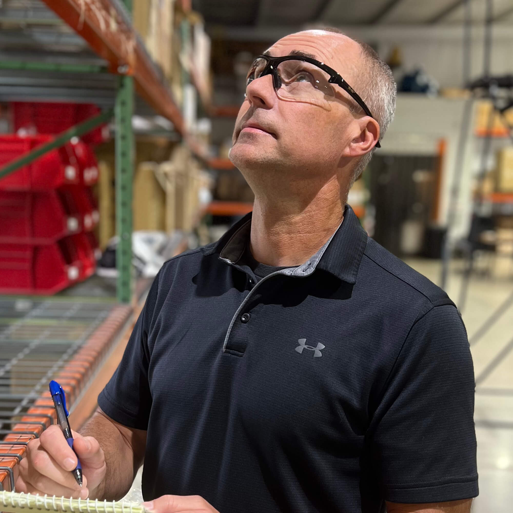 Worker wearing KleenGuard 30-06 Dual Readers Safety Glasses With Clear Lenses