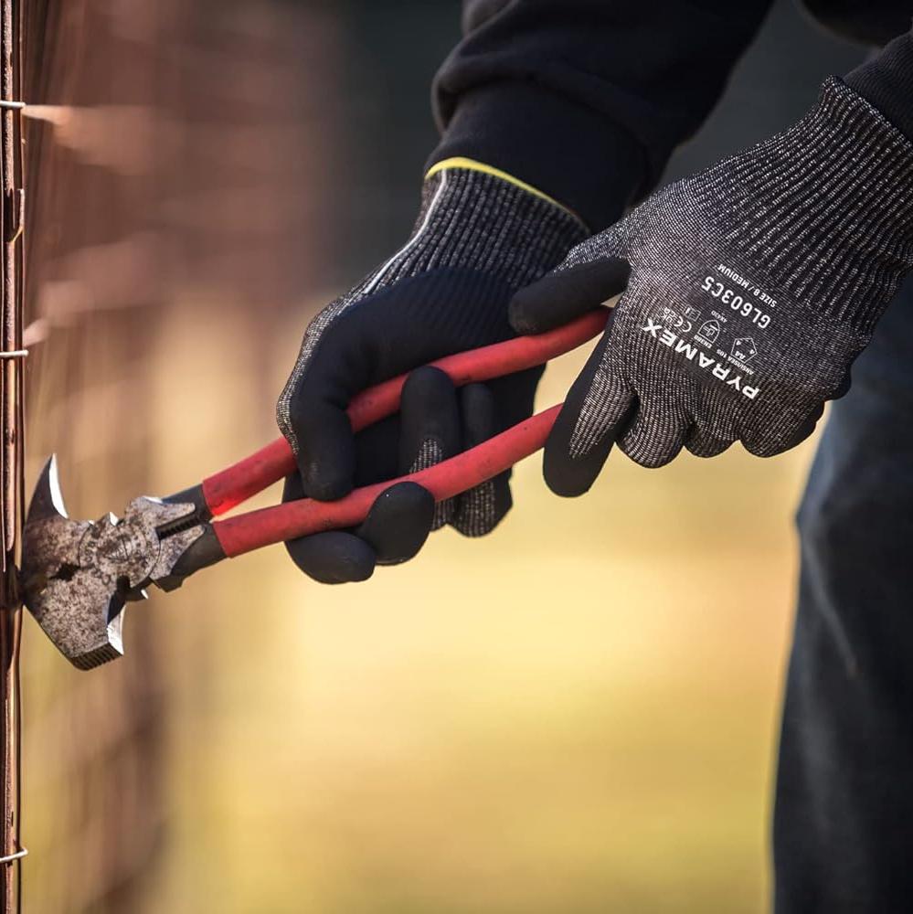 Pyramex GL603C5 Cut-Resistant A4 Work Gloves working on a fence
