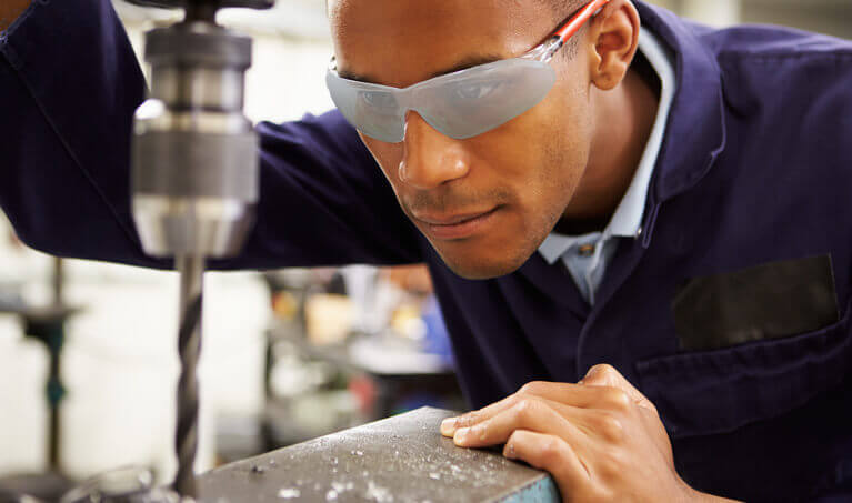 Machinist wearing foggy safety glasses