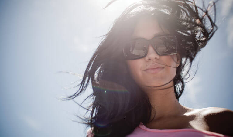 Woman wearing sunglasses on a bright day