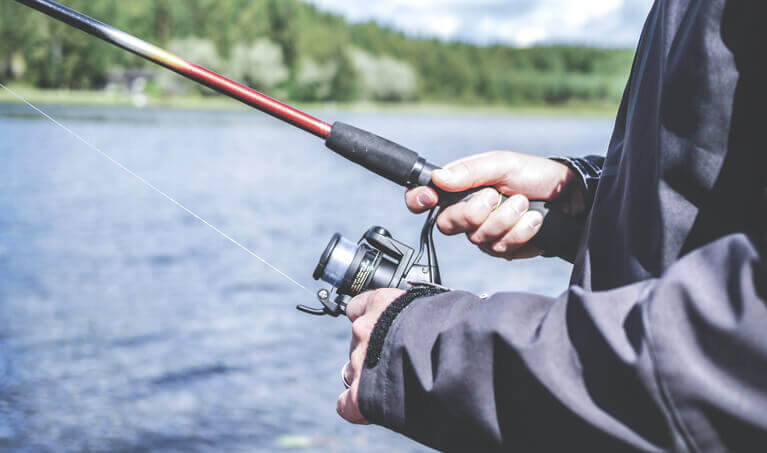 Fisherman using a fishing rod