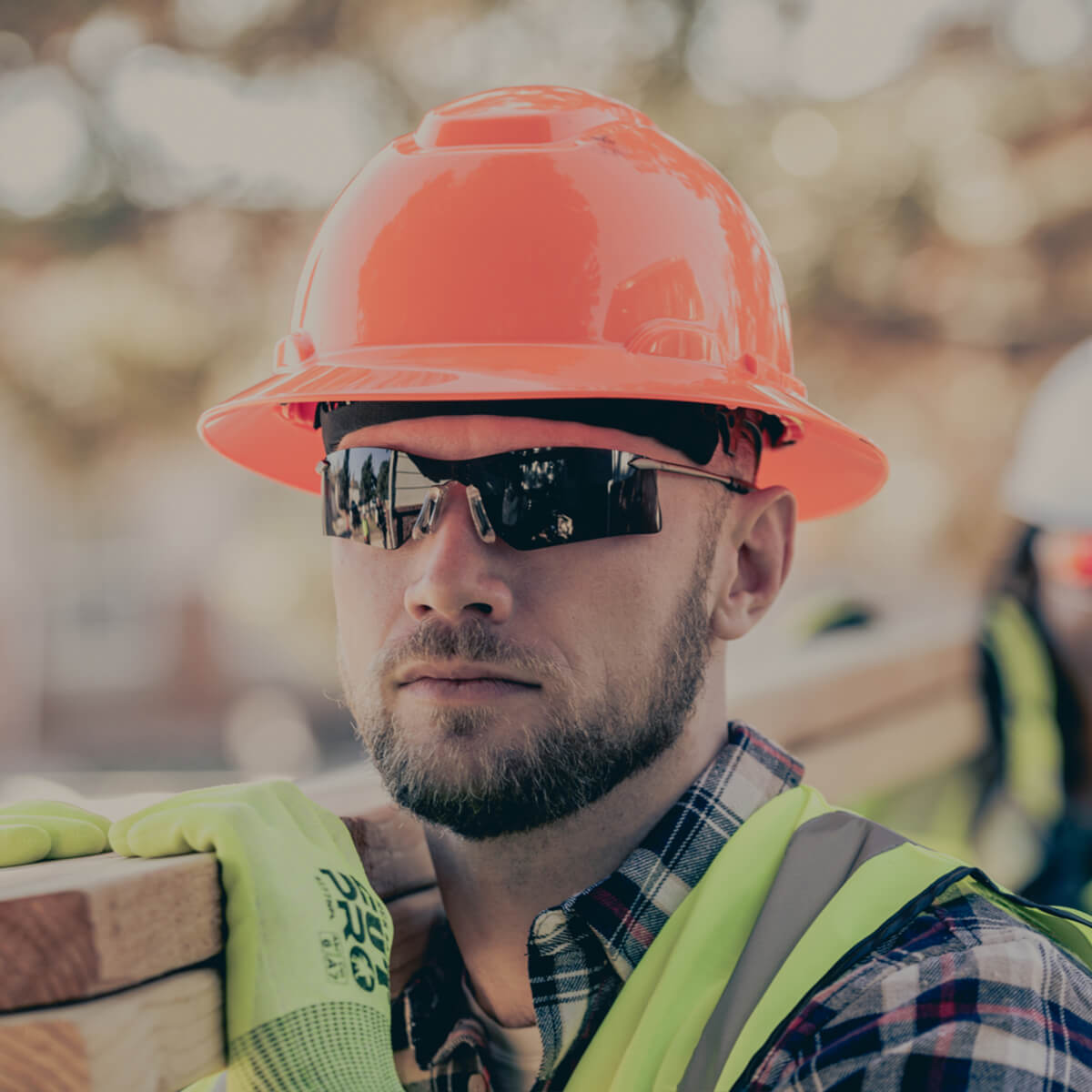 MCR Safety T4112AF Rubicon T4 Safety Glasses worn by a construction worker wearing a hard hat