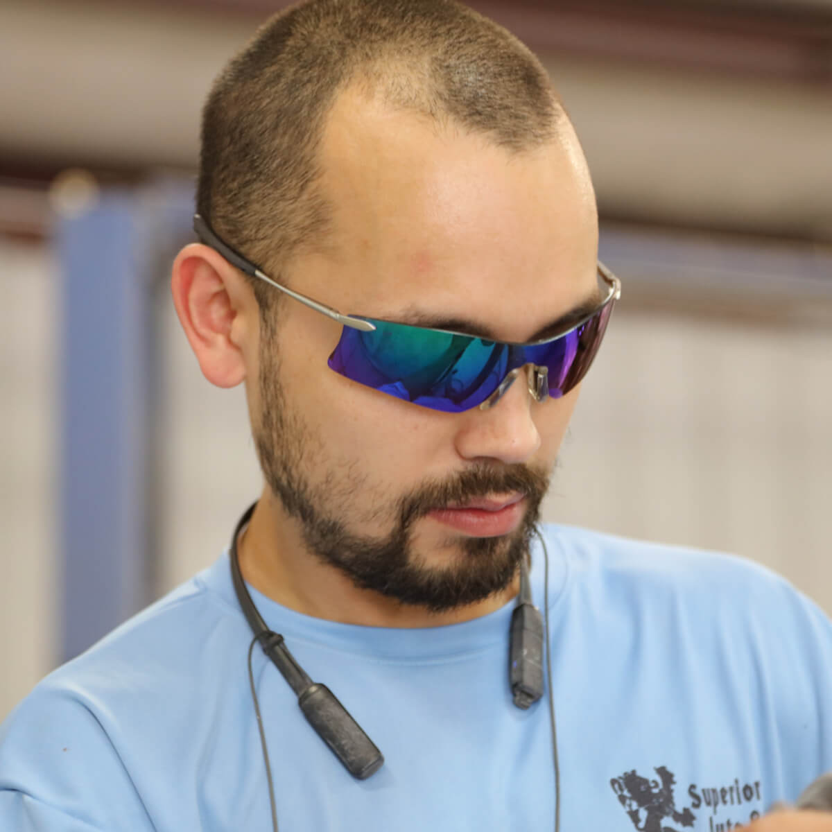 MCR Safety T411G Rubicon T4 Safety Glasses with Emerald Mirror Lens worn by worker