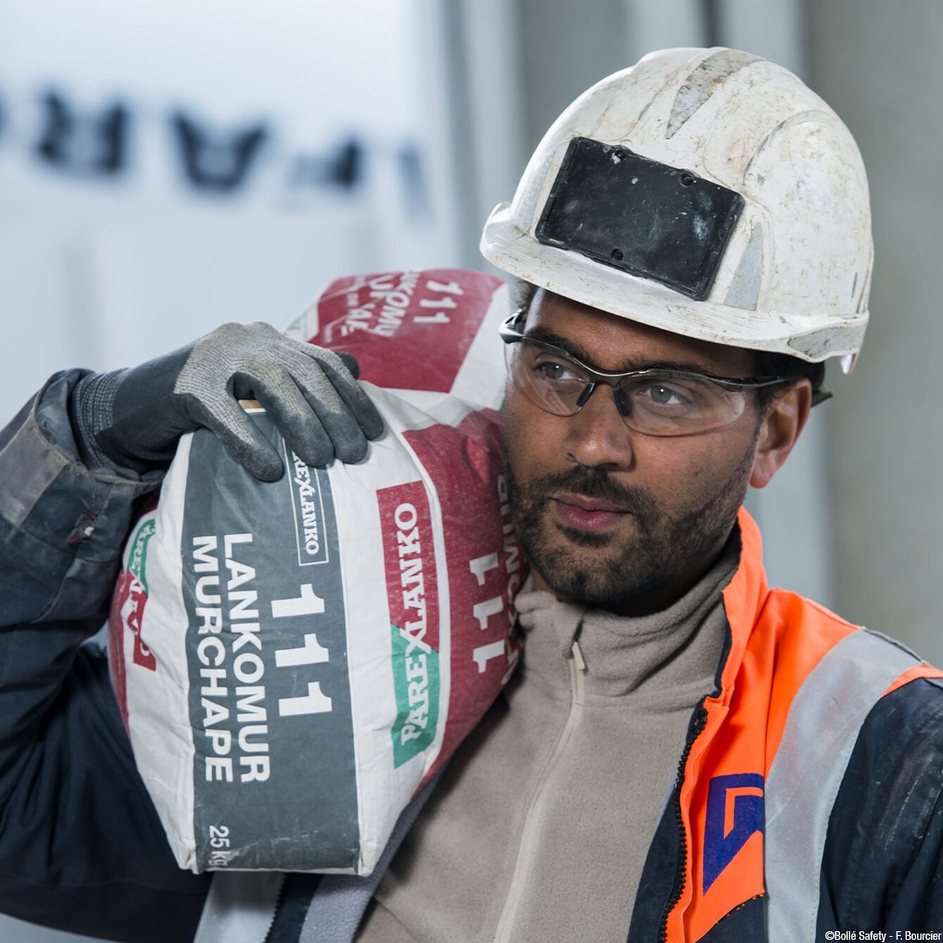 Bolle Contour Safety Glasses with Gunmetal Frame and Clear Anti-Fog Lenses worn by worker